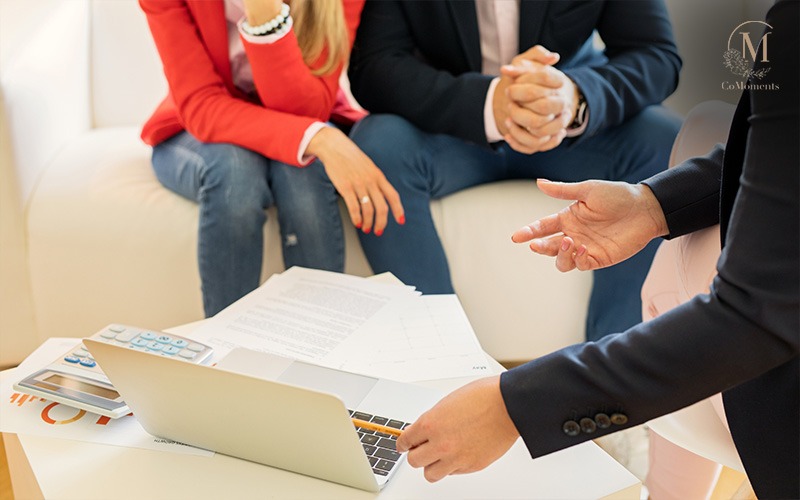 A wedding planner liaising with couple