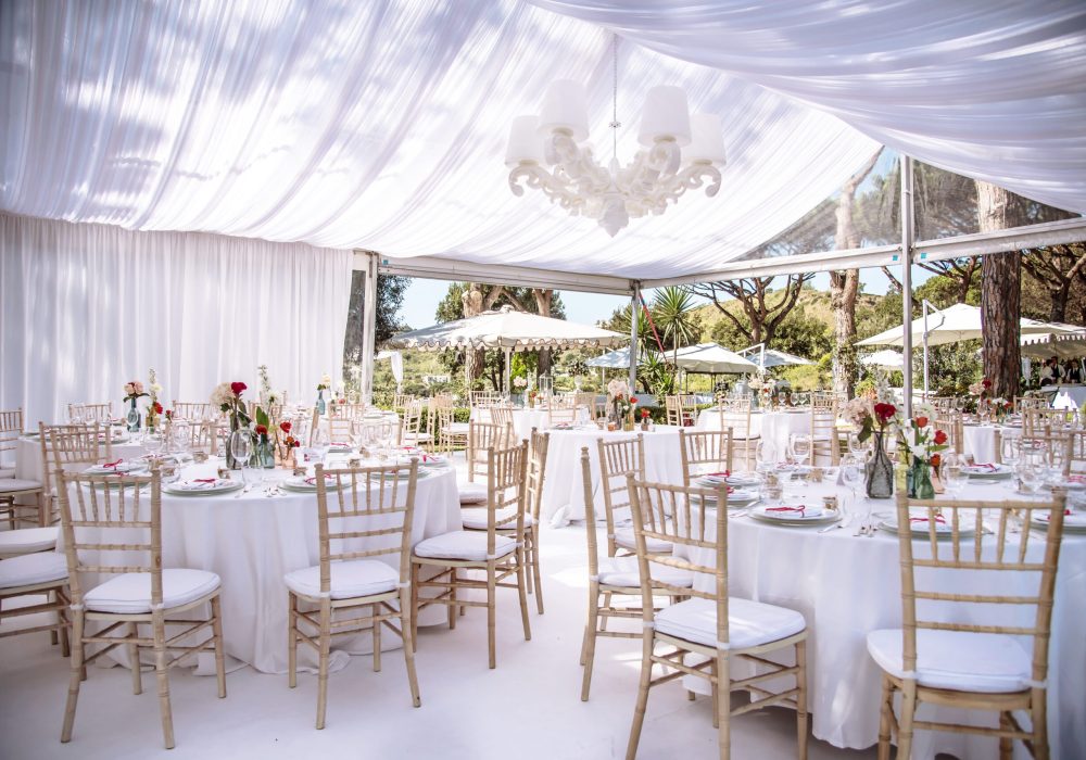 Setting up for the ultimate wedding  venue in a marquee, all in white in Naples Italy